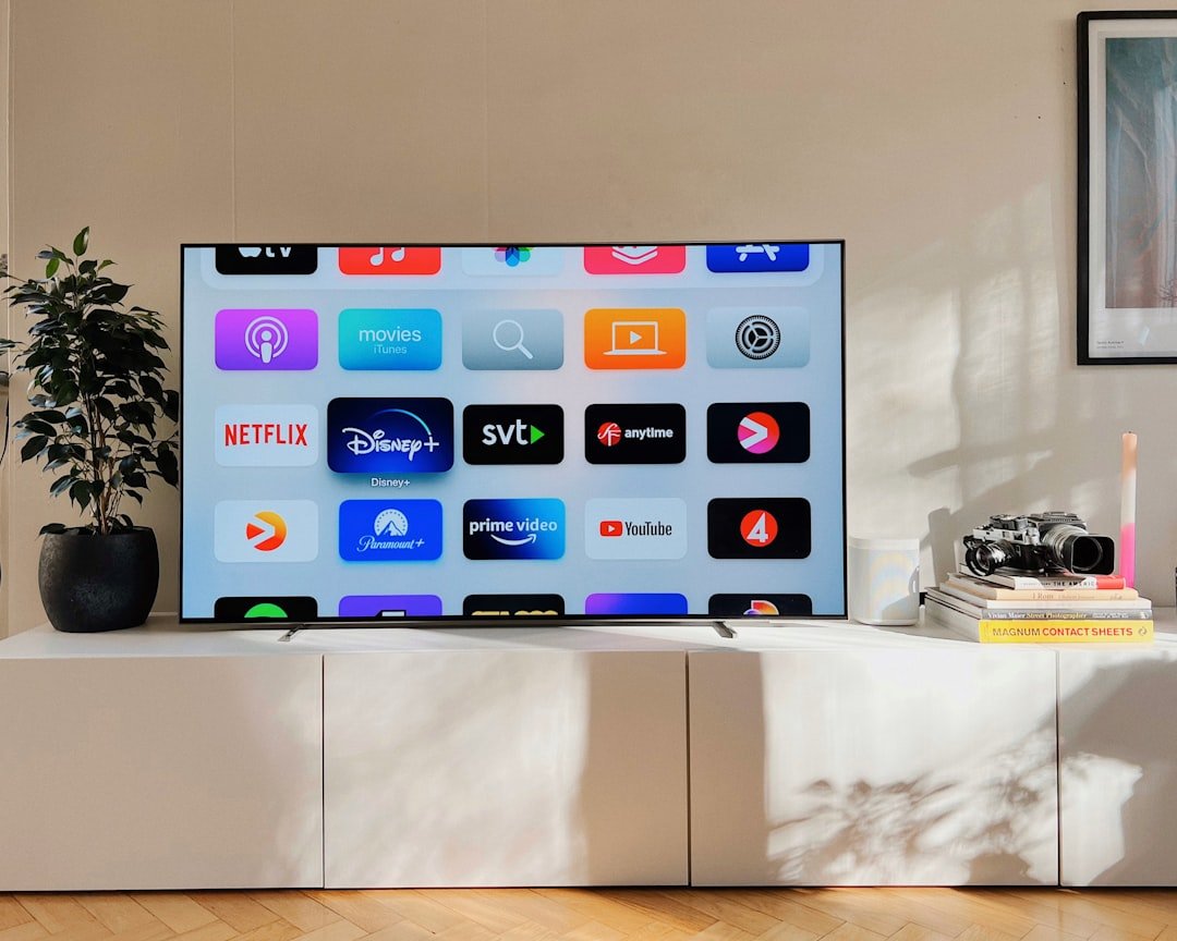 a-flat-screen-tv-sitting-on-top-of-a-white-cabinet-sd87v72cjeu